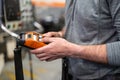 Factory worker. Technician controlling a heavy crane in factory, close up at his hands holding a crane controller. Royalty Free Stock Photo