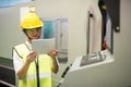 Factory worker use tablet to program microchip machine Royalty Free Stock Photo