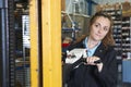 Factory Worker Using Powered Fork Lift To Load Goods Royalty Free Stock Photo