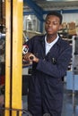 Factory Worker Using Powered Fork Lift To Load Goods Royalty Free Stock Photo