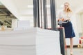 Factory Worker Using Powered Fork Lift To Load Goods. young woman Royalty Free Stock Photo