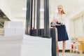 Factory Worker Using Powered Fork Lift To Load Goods. young woman Royalty Free Stock Photo