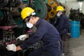 Factory worker wearing face mask for protect virus, working at factory