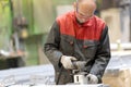 Factory worker working in manufacture workshop Royalty Free Stock Photo