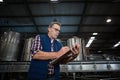 Factory worker writing on clipboard in factory Royalty Free Stock Photo