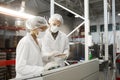 Factory Workers at Control Panel