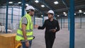 Factory workers deliver boxes package on a pushing trolley in the warehouse . Royalty Free Stock Photo