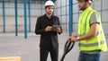 Factory workers deliver boxes package on a pushing trolley in the warehouse . Royalty Free Stock Photo