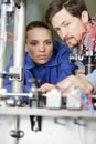 factory workers solving problem together Royalty Free Stock Photo