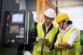 Factory workers use corporate app in tablet Royalty Free Stock Photo