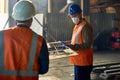 Factory workers using lifting beam Royalty Free Stock Photo