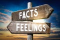 Facts, feelings - wooden signpost, roadsign with two arrows