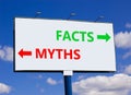 Facts or myths symbol. Concept word Myths and Facts on beautiful billboard with two arrows. Beautiful blue sky with clouds Royalty Free Stock Photo