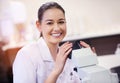 The facts are right in front of me. Portrait of a young scientist using a microscope in a laboratory. Royalty Free Stock Photo