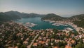 a factual, straightforward view of a harbor from above, showcasing the boats present in the area, Aerial view of Marmaris in Mugla