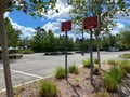 A faculty parking sign in a parking lot of a university office building requiring B Permits