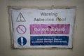 Faded Asbestos roof warning sign