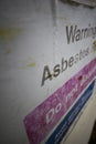Faded Asbestos roof warning sign