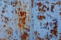 faded blue paint on flat sheet steel surface with stains of rust - full-frame background and texture Royalty Free Stock Photo