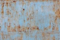 faded blue paint on flat sheet steel surface with stains of rust - full-frame background and texture Royalty Free Stock Photo