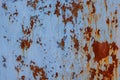 faded blue paint on flat sheet steel surface with stains of rust - full-frame background and texture Royalty Free Stock Photo