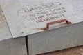 A faded Danger, Confined Space Entry Permit Required warning sign on the uplifing door of an inground grain storage bin Royalty Free Stock Photo