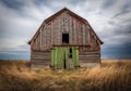 Faded Green Barn Double Doors in a Moody Countryside Setting Royalty Free Stock Photo