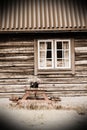 Faded image of bench with flower pot in front of house