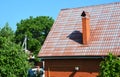 Faded metal roof lost its color, is in bad condition and needs painting and restoration Royalty Free Stock Photo