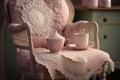 A faded pink armchair with a white lace trim sits before a dainty tea table overflowing with crocheted doilies Interior Royalty Free Stock Photo