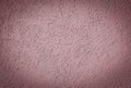 Faded pink Textured cement or concrete wall background with darkened corners. Deep focus. Mock up or template for modern design