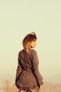 Faded portrait of woman looking over shoulder