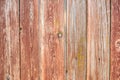 Faded red old wooden planking background with cracks Royalty Free Stock Photo