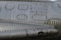 Faded rivets with rust on aluminium fighter plane at Chateau de Savigny near Beaune in Burgundy, France