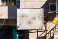 Faded in the sun poster with emblems of the resistance of the Israeli occupation on the street of Bethlehem in Palestine