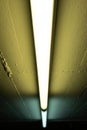 Faded yellow green and cyan colored neon lights dark mood interior shallow depth of field Royalty Free Stock Photo