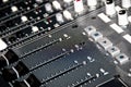 Faders and buttons on a mixing board