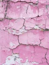 Fading pink paint on a rough surface shows the beauty of impermanence, with every crack and chip telling a silent story Royalty Free Stock Photo