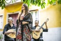 Fado band performing traditional portuguese music in the courtyard in Lisbon, Portugal Royalty Free Stock Photo