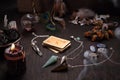 Faerie accessories. A deck of old divination cards and a stone pendulum. Royalty Free Stock Photo