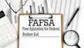 FAFSA. Free application for federal student aid. A text on clipboard on chart Royalty Free Stock Photo