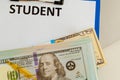 Fafsa. Student aid concept. Application form of document on the table with money. Royalty Free Stock Photo