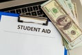 Fafsa. Student aid concept. Application form of document on the table with money. Royalty Free Stock Photo