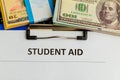 Fafsa. Student aid concept. Application form of document on the table with money. Royalty Free Stock Photo