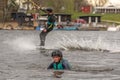 Fagersta, Sweden - Maj 07, 2020: Girl teenager wakeboarder fells into the water after an unsuccessful jump