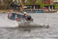 Fagersta, Sweden - Maj 07, 2020: Girl teenager wakeboarding fells into the water after an unsuccessful jump