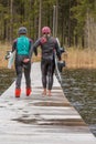 Girl teenager wakeboarding girls go on the pier