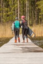 Fagersta, Sweden - Maj 07, 2020: Girls teenagers wakeboarder go on the pier