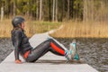 Fagersta, Sweden - Maj 07, 2020: Teen girl wakeboarde is resting on the pier