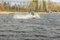 Teenager wakeboarding on a lake in spring in Sweden during a physical education lesson